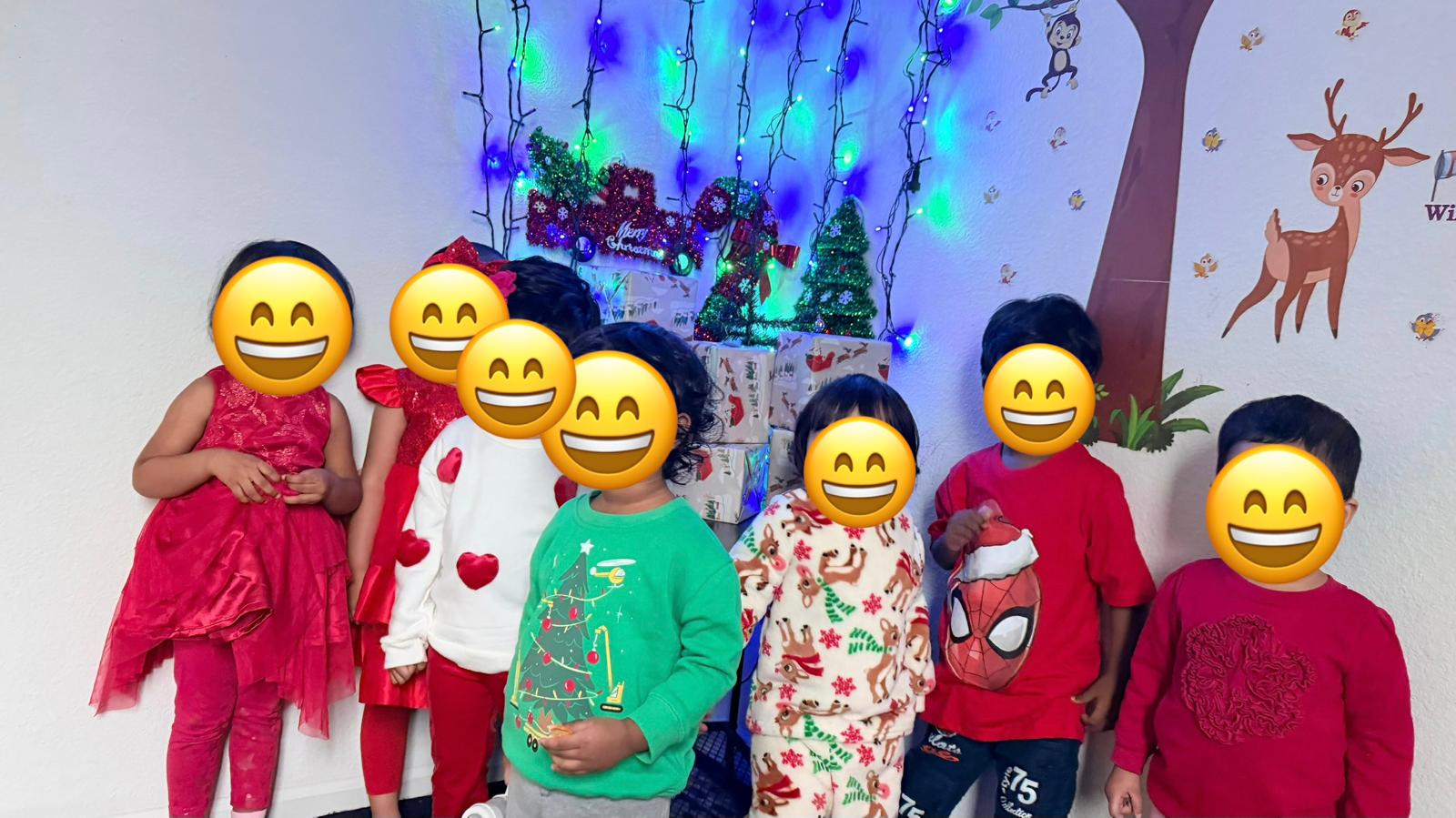 Children standing near holiday decorations