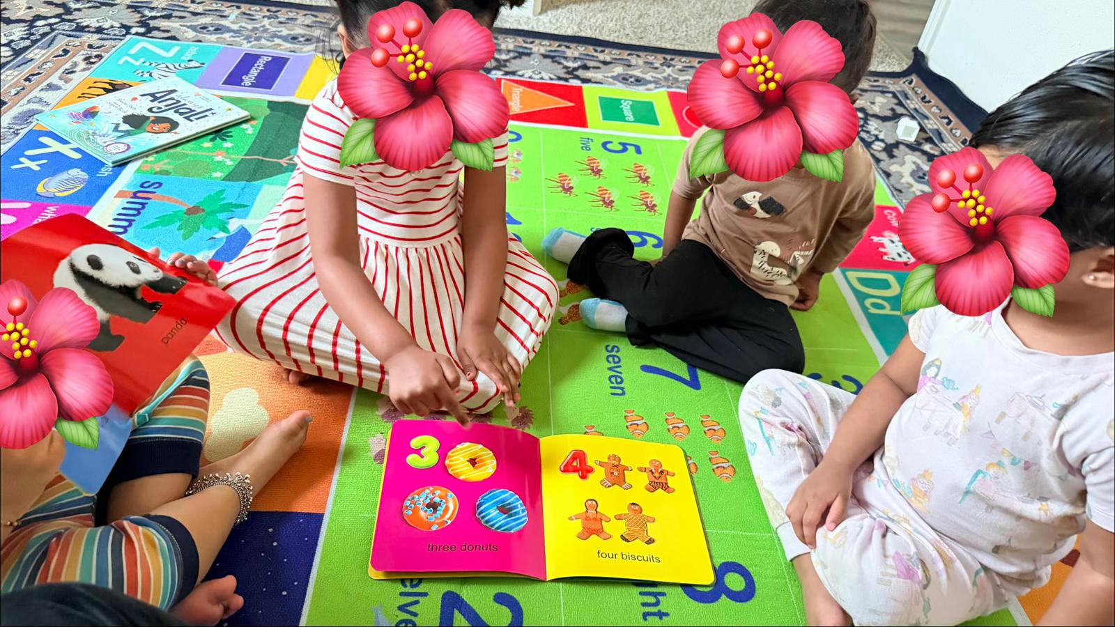 Children learning numbers together on a colorful mat